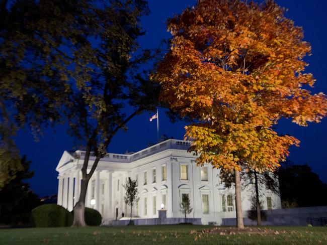 The White House is lit up in Washington as Americans cast their votes, marking the end of a bitterly divisive presidential campaign. Picture: Manuel Balce Ceneta/AP