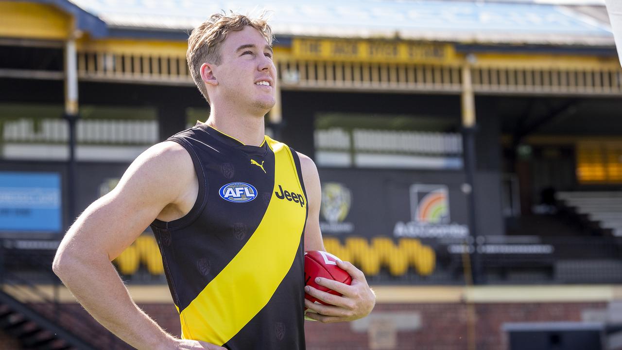 Richmond recruit Tom Lynch poses for a photograph in front of the Jack Dyer Stand at Punt Road Oval, during a Richmond Tigers press conference in Richmond, Melbourne, Monday, October 8, 2018. (AAP Image/Daniel Pockett) NO ARCHIVING