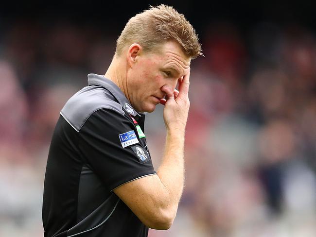 MELBOURNE, AUSTRALIA - JULY 08:  Nathan Buckley, coach of the Magpies speaks to his team during a quarter time break during the round 16 AFL match between the Collingwood Magpies and the Essendon Bombers at Melbourne Cricket Ground on July 8, 2017 in Melbourne, Australia.  (Photo by Scott Barbour/Getty Images)