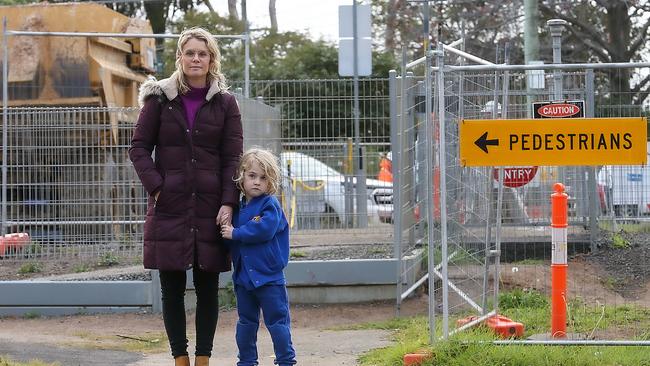 Traffic near the Level Crossing Removal Project in Mentone has parents worried. Alison Van den Dungen with her son Johannes 5yrs at the crossing on Como Pde. Picture : Ian Currie