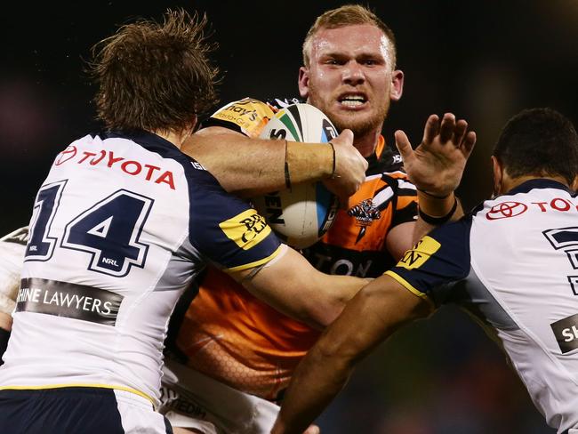 Matthew Lodge of the Tigers is tackled. Picture: Getty