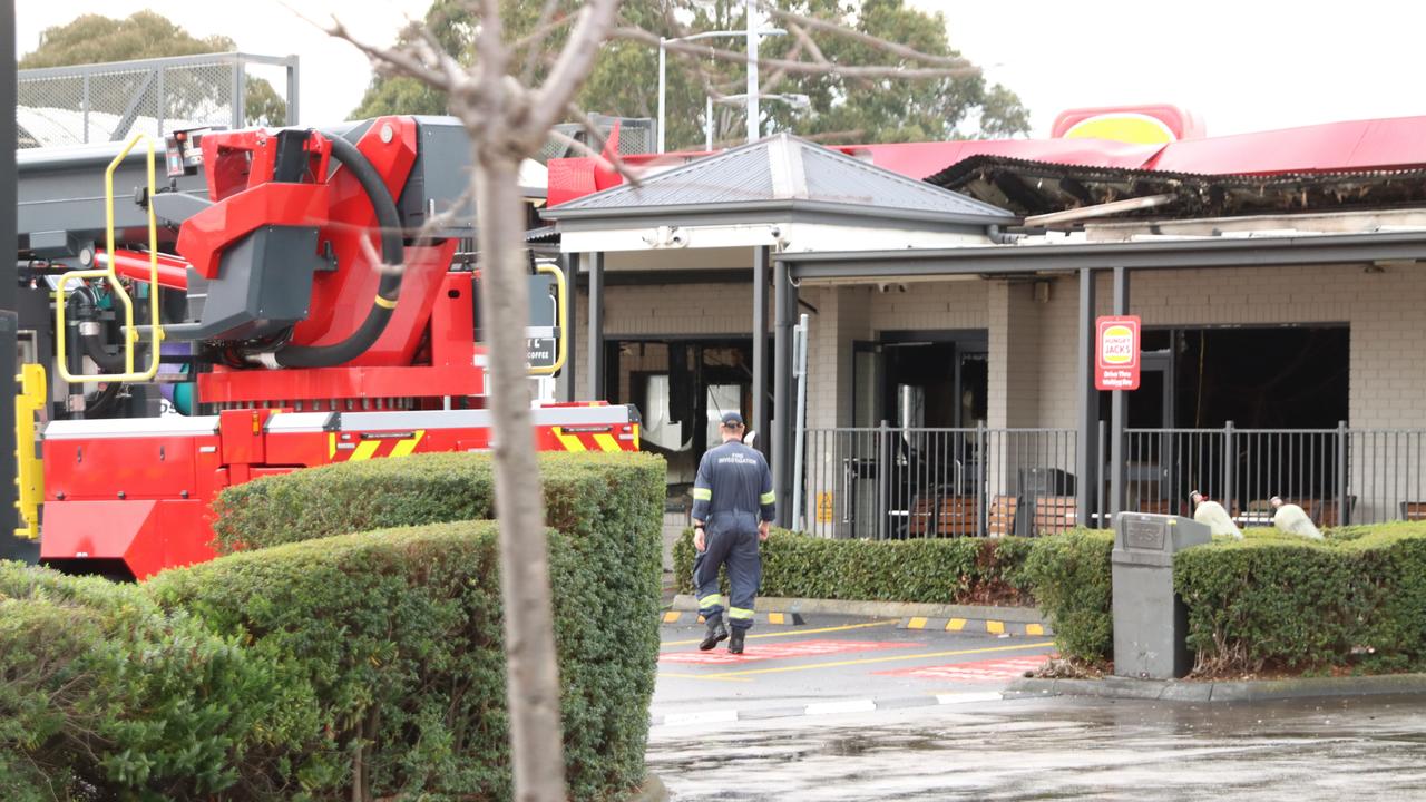 Fire crews remain on the scene at Glenorchy's Hungry Jack's which has been significantly damaged from a fire. Picture: Craig Herbert