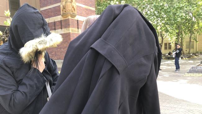 Lie Ke and her daughter Xiayou Ke leave Parramatta Local Court. The family is accused of a $1 million baby formula syndicate.