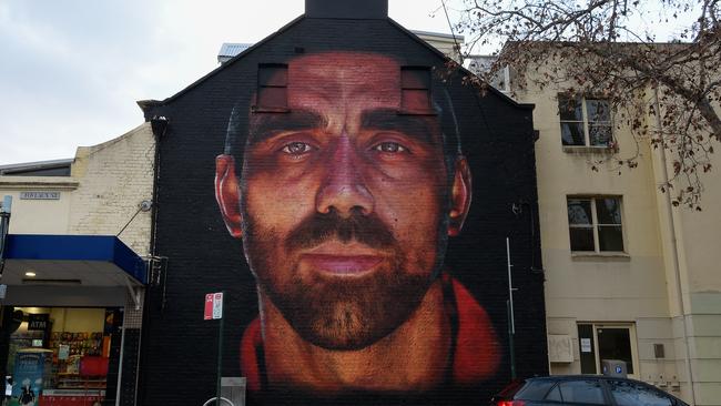 A mural of former AFL player Adam Goodes has been created in Sydney. The Australian of the Year and Sydney Swans icon polarised crowds after taking a stand against racism and was effectively booed into retirement. Picture: AAP Image/Bianca De Marchi