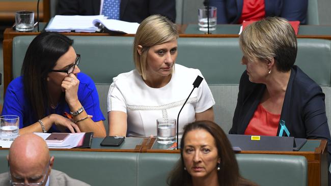 Tanya Plibersek, right, speaks to Labor backbench MP Susan Lamb, centre. Picture: AAP