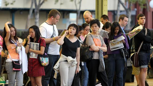 Generic photo of crowd of people waiting for their train on platform at Central Railway Station in Sydney, NSW, to accompany story on immigration and population growth.