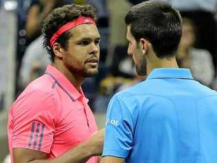 Novak Djokovic of Serbia (right) and Jo-Wilfried Tsonga of France at the net after Tsonga retired due to injury in their quarter-final at the US Open. Picture: JUSTIN LANE