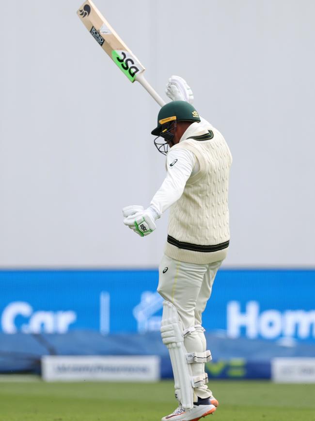 And throws his bat in celebration Picture: Getty Images