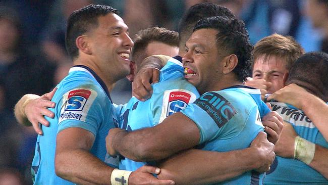 The Waratahs celebrate their victory.