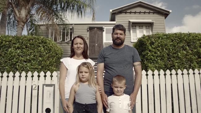 Kim and Josh Miller with their kids in front of their home on Resilience Road. Picture: Contributed