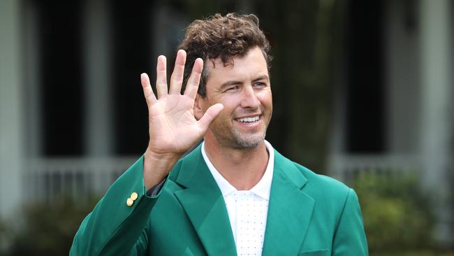 Adam Scott in his green jacket.