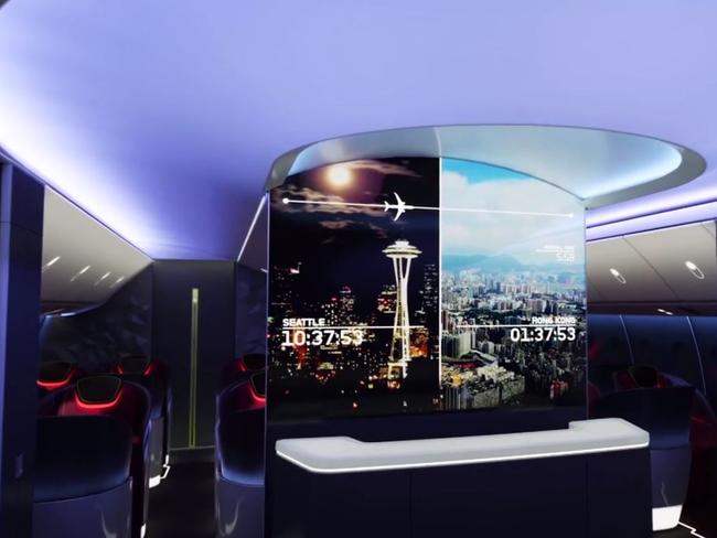 With a large screen in the background, you can visit a bar for food or drinks if you’re in first or business class. Picture: Boeing