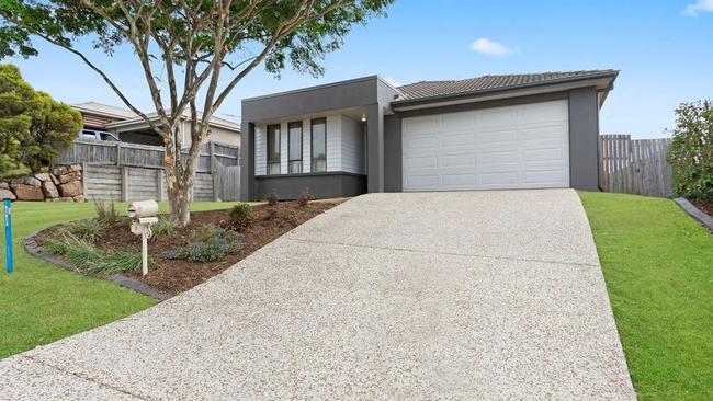 This four-bedroom house at 7 Stanbury Dr, Goodna, is for sale for offers over $550,000.