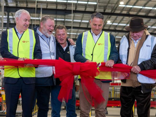 (From L to R) Paul Graham, David Fox, Andrew Fox, Defence Minister Richard Marles and Lindsay Fox open the new Australia Post parcel facility at Avalon, Victoria, on October 12, 2023. Picture: Supplied