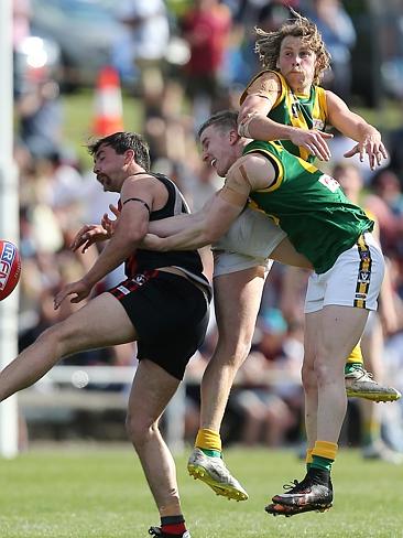 Gippsland Football League Grand Final match between Maffra Eagles and Leongatha Parrots. Maffra became the 2016 premiers, defeating Leongatha 13.10 (88) to 9. 16 (67). James Huts gets a kick away despite pressure from Cade Maskell and Aaron Hillberg. Picture: Yuri Kouzmin