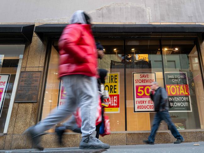 NEW YORK, NEW YORK - JANUARY 13: People walk by a Macy's store in Brooklyn after the company announced it was closing the store along with over 60 others on January 13, 2025 in New York City. Macy's, once the nation's premier department store, has struggled in recent years with the competition from online retailers and discount stores such as Walmart. Macy's has said that the closures would allow them to prioritize its roughly 350 Macyâs remaining locations.   Spencer Platt/Getty Images/AFP (Photo by SPENCER PLATT / GETTY IMAGES NORTH AMERICA / Getty Images via AFP)