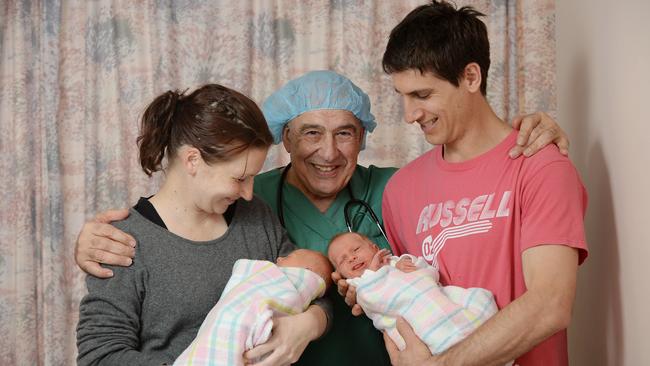 Dr John Svigos in 2014 with baby twins Lucia and Anna Centofanti who were born at the WCH, and their parents Nicola and David. Photo: Naomi Jellicoe