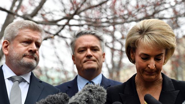 Mitch Fifield, left, Mathias Cormann, centre, and Michaelia Cash, right, at a press conference to announce their support for Peter Dutton as prime minister.