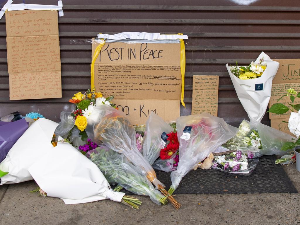 Tributes have been laid outside the takeaway shop where couple Hoa Tek Cien and Heang Kim Gau were found dead. Picture: NewsWire / Simon Bullard.