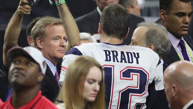 NFL commissioner Roger Goodell speaks to Tom Brady, the player he suspended for the first four games of the season. Picture: Getty