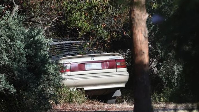 Police inspect the car that was allegedly involved in the hit-run. Picture: Tony Gough