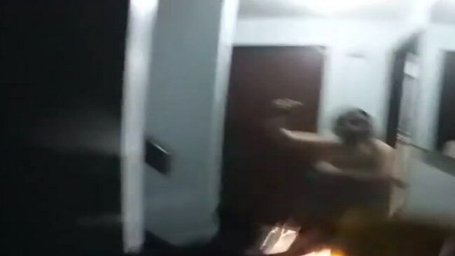 Police body-cam footage of Brianna Lenehan charging at a police officer with a kitchen knife. Picture: Supplied