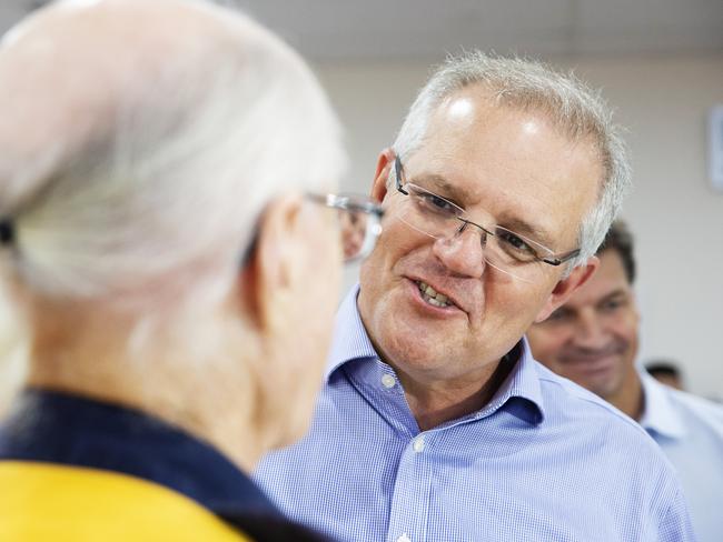 Mr Morrison talks to a volunteer at The Picton Evacuation Centre. Picture: Jenny Evans