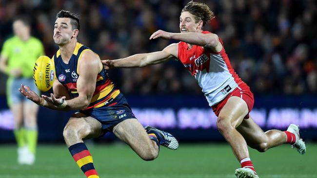 Taylor Walker of the Crows marks in front of Dane Rampe of the Swans in the round 22 clash at Adelaide Oval. Picture: Mark Brake/Getty Images