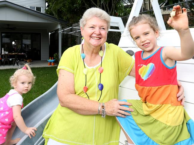 Ferny Grove’s Maureen Bailey and her granddaughters Peyton and Willow with one of 100 Golden Avocados. Picture: Steve Pohlner