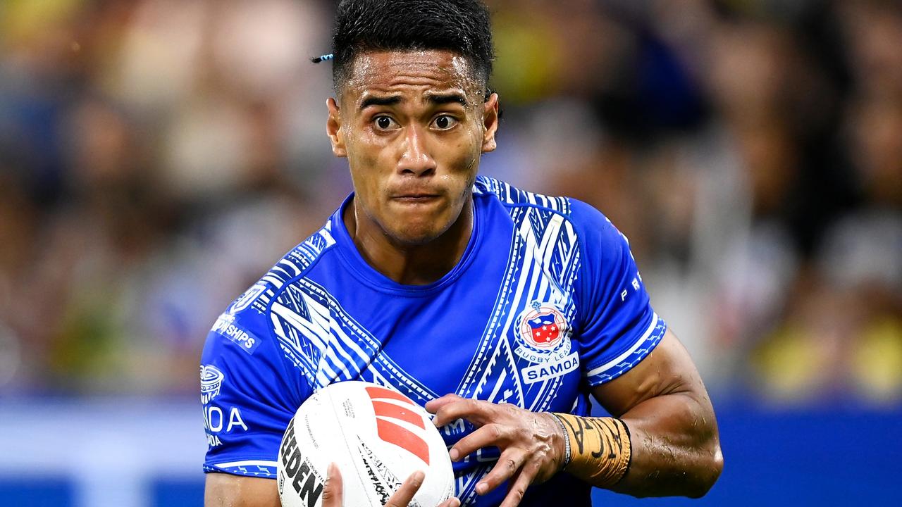 TOWNSVILLE, AUSTRALIA - OCTOBER 14: Sualauvi Faalogo of Samoa runs the ball during the Mens Pacific Championship match between Australia Kangaroos and Samoa at Queensland Country Bank Stadium on October 14, 2023 in Townsville, Australia. (Photo by Ian Hitchcock/Getty Images)
