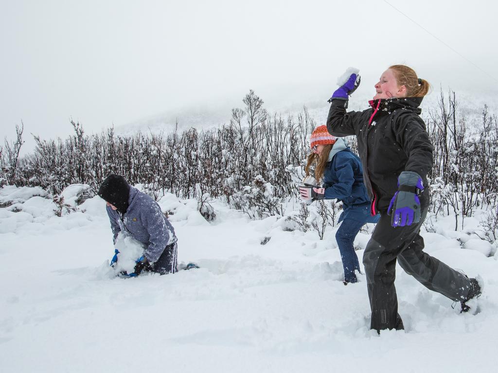 SNOW FUN: Keegan Flood, Maddison Hughes and Bryanna Flood play in thick snow at Tim Shea, in Mt Field National Park. Picture: GREG POWER