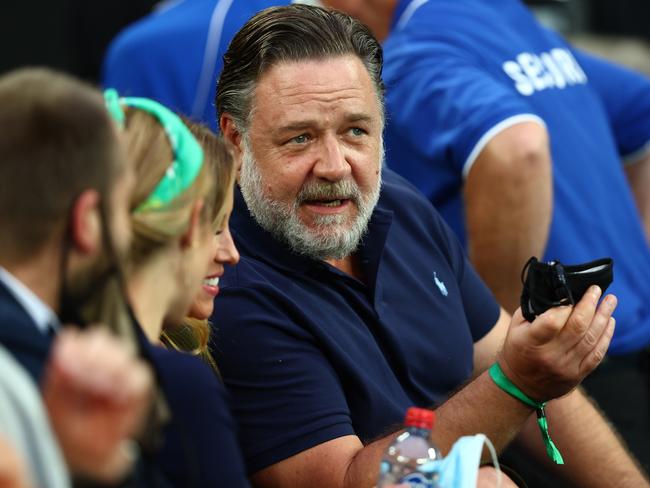 Russell Crowe cheers on Ash Barty at the tennis final. Picture: Clive Brunskill/Getty