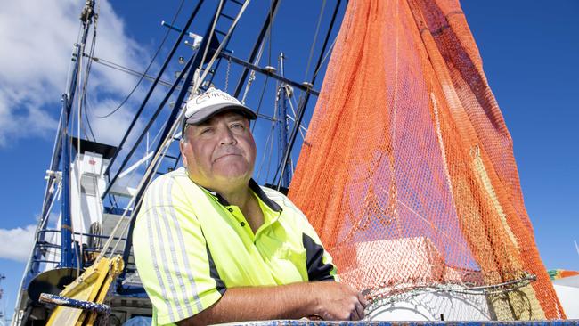 Prawn fisherman and chief deckhand on the Challenge Sid Dowd takes break from tending fishing nets. Picture: Mark Brake