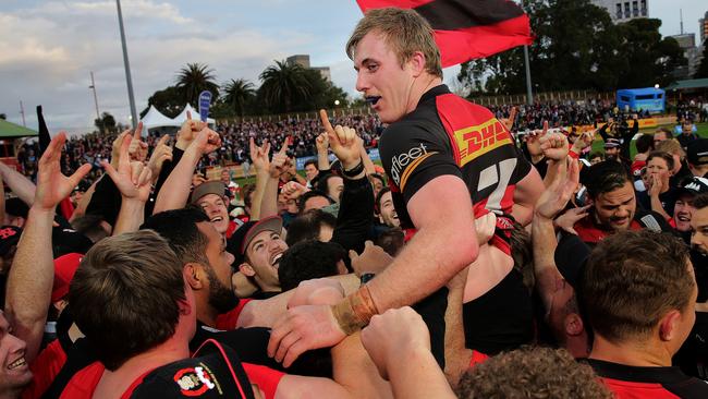 Captain Will Miller is hoisted above the crowd by supporters after Northern Suburbs won the Shute Shield over Sydney University in their grand final clash at North Sydney Oval. Northern Suburbs broke a 41-year premiership drought, taking out the game 28-15. Picture: Troy Snook