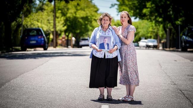 Wendy Curtis – holding a picture of her husband Brenton who was struck and killed by a speeding, unlicensed driver – with daughter Kimberly Gilmour. Picture: Mike Burton