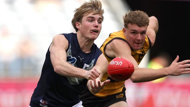 PERTH, AUSTRALIA - JUNE 23: Tom Gross of Victoria Metro handballs during the Marsh AFL National Championships match between U18 Boys Western Australia and Victoria Metro at Optus Stadium on June 23, 2024 in Perth, Australia. (Photo by Paul Kane/AFL Photos/via Getty Images)