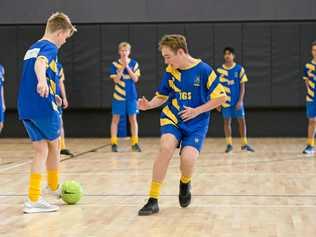 SKILL SESSION: Toowoomba Grammar School football players Dylan Proctor (left) and James O'Sullivan brush up on their ball control skills in the school's new gymnasium. The school's Bill Turner Cup squad will face Kawana Waters State College for a spot in the Queensland final of the nation-wide competition. Picture: Kevin Farmer