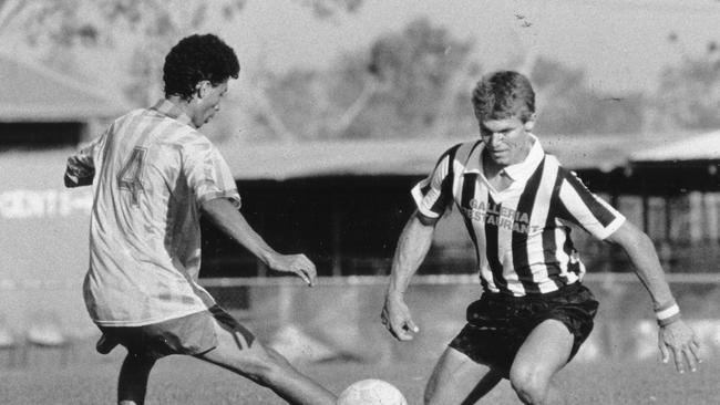 Casuarina's Stewart Berger manages to get the ball away from Sanderson's Isidro de Castro during a soccer match at Gardens in September, 1989.