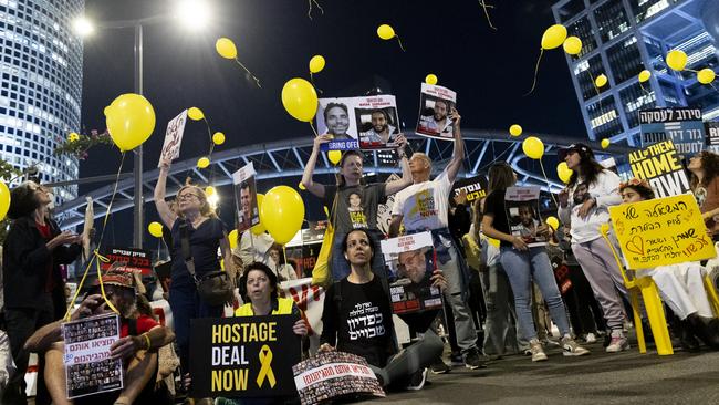 Families of hostages held in the Gaza Strip and supporters release yellow balloons during a demonstration calling for a hostage deal. Picture: Getty Images.