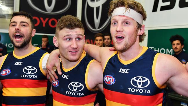 Adelaide’s Rory Atkins, Rory Laird and Rory Sloane sing the club song after beating Geelong. Picture: Daniel Kalisz/Getty Images