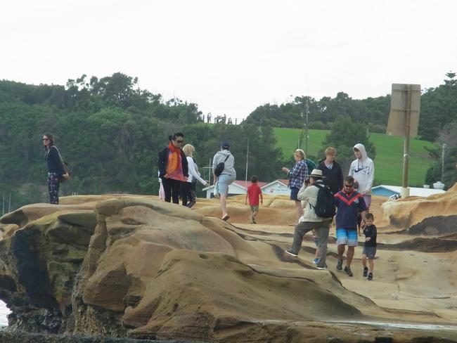 Large numbers of people on Terrigal headland.