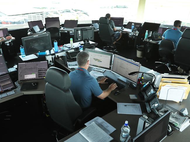 26/3/2019: Air traffic controllers in the control tower for Airservices Australia, above  Brisbane Airport  Brisbane airport. Lyndon Mechielsen/The Australian