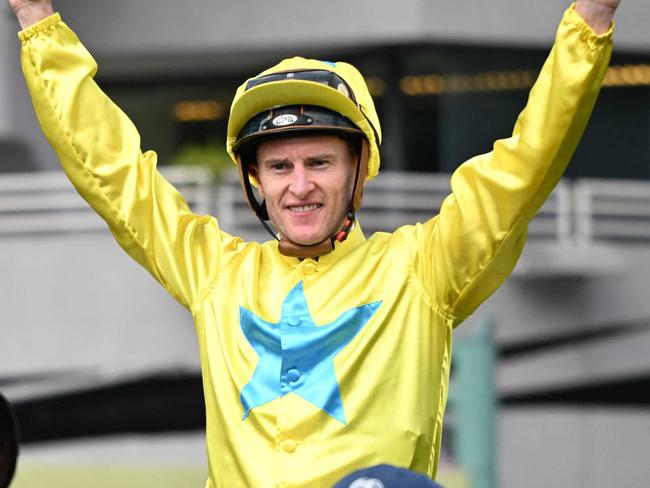 Lucky Sweynesse ridden by Zac Purton celebrates winning the Group 1 Sprint race during the Hong Kong International Races at Sha Tin Racecourse in Hong Kong on December 10, 2023. (Photo by Peter PARKS / AFP)