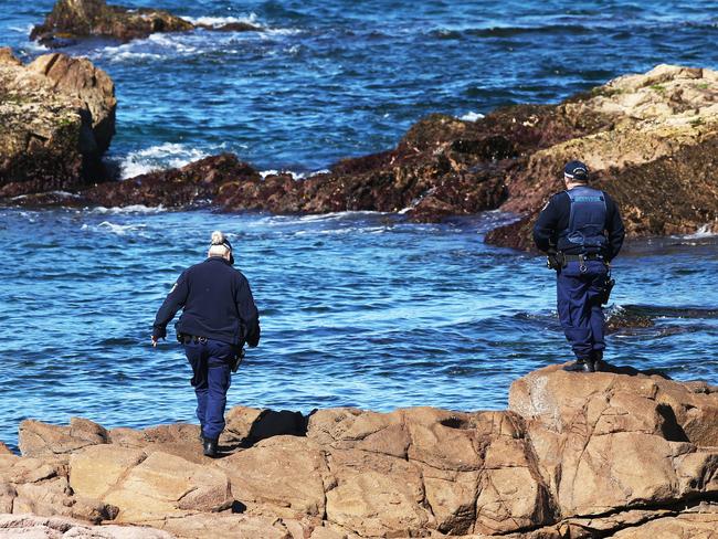 Police officers during the search on Saturday. Picture: Peter Lorimer