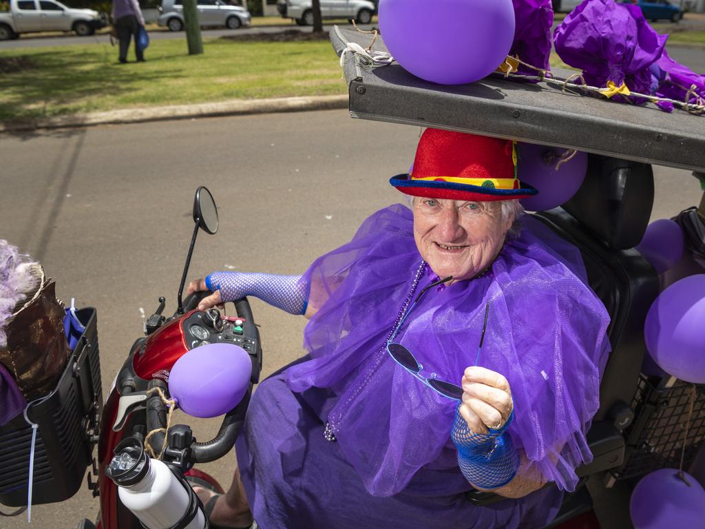 Getting in touch with her purple side on Jacaranda Day is Diana Collins who has lived in Goombungee for the past 35 years. Picture: Kevin Farmer