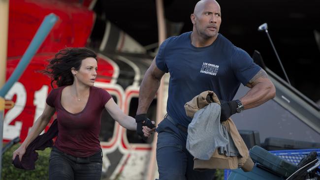 Dwayne Johnson and Carla Gugino in San Andreas.