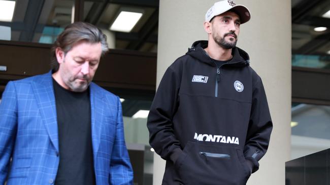 He walked out of court with his manager Anthony Van Der Wielen (left) after being granted bail. Picture: NCA NewsWire / Philip Gostelow