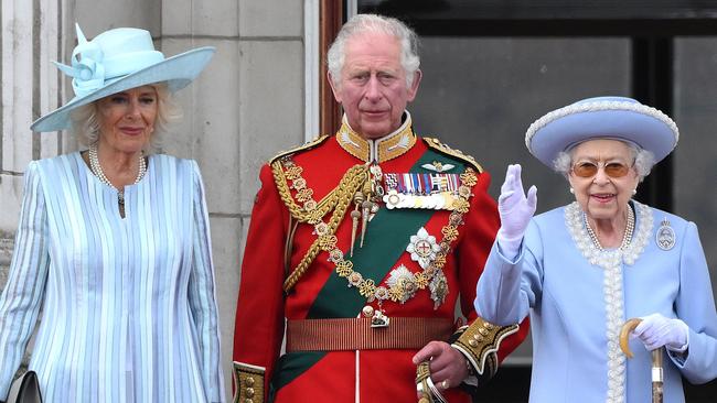 The Queen watches the 71 plane fly-past withPrince Charles and Camilla. Picture: AFP.