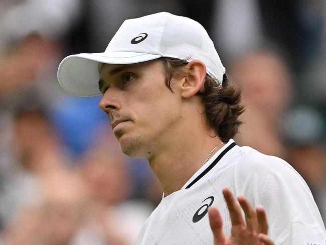 Australia's Alex De Minaur reacts after winning against France's Arthur Fils during their men's singles fourth round tennis match on the eighth day of the 2024 Wimbledon Championships at The All England Lawn Tennis and Croquet Club in Wimbledon, southwest London, on July 8, 2024. De Minaur won the match 6-2, 6-4, 4-6, 6-3. (Photo by Glyn KIRK / AFP) / RESTRICTED TO EDITORIAL USE