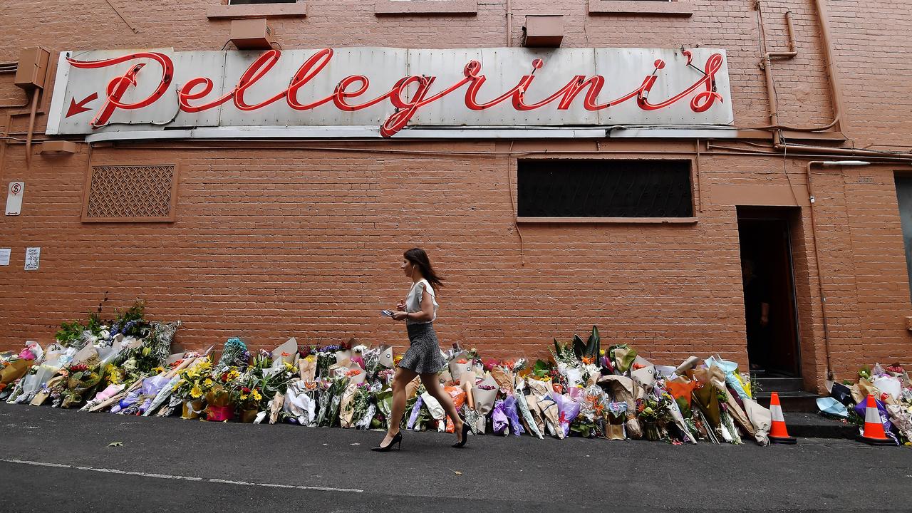 People pay their respects at Pellegrini’s Espresso Bar after owner Sisto Malaspina was killed during a terrorist attack. Picture: Jake Nowakowski